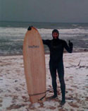 JJ with Soultree board on the beach